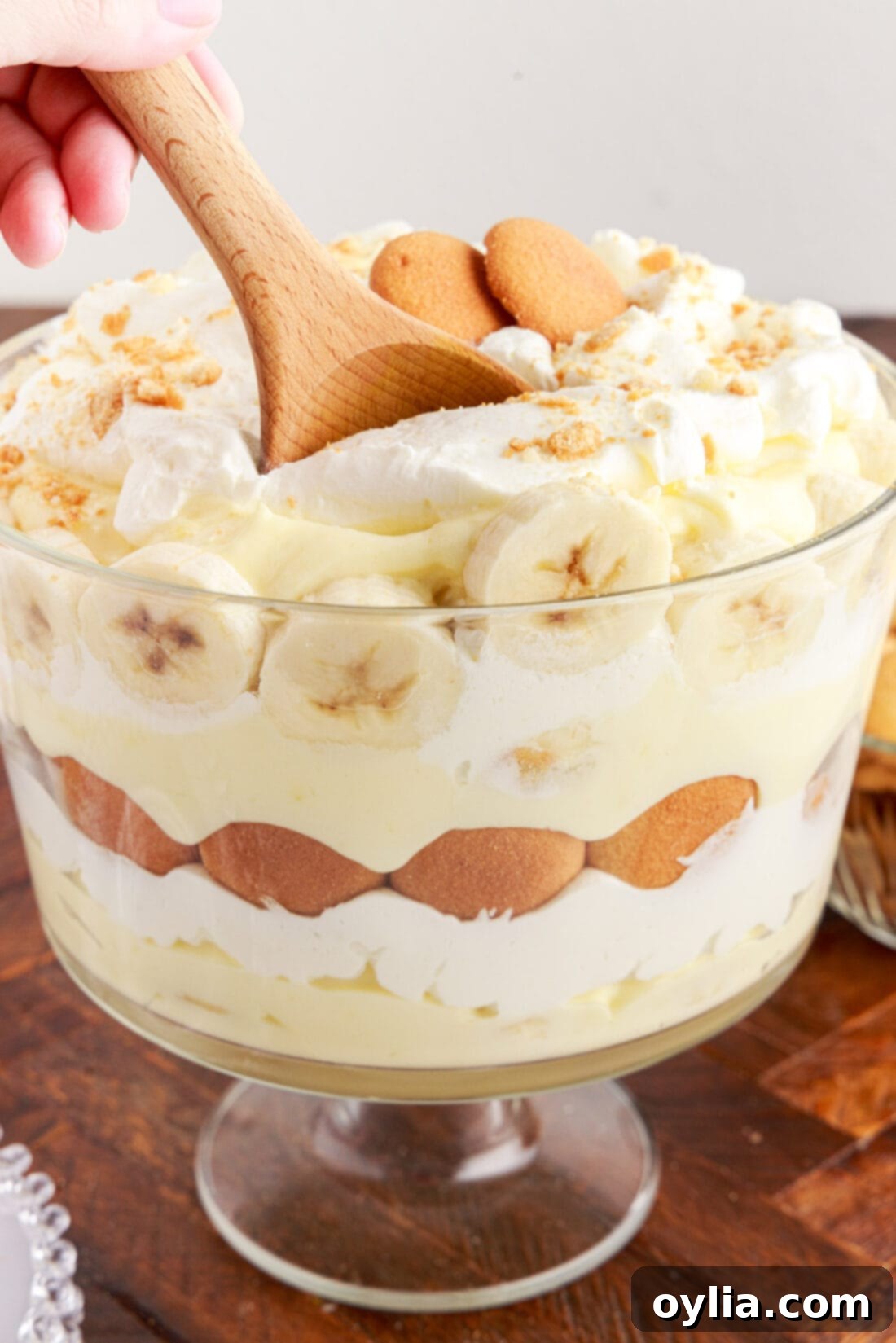 Banana Dream Trifle 3 Serving spoon digging into a Banana Trifle, showing its creamy layers