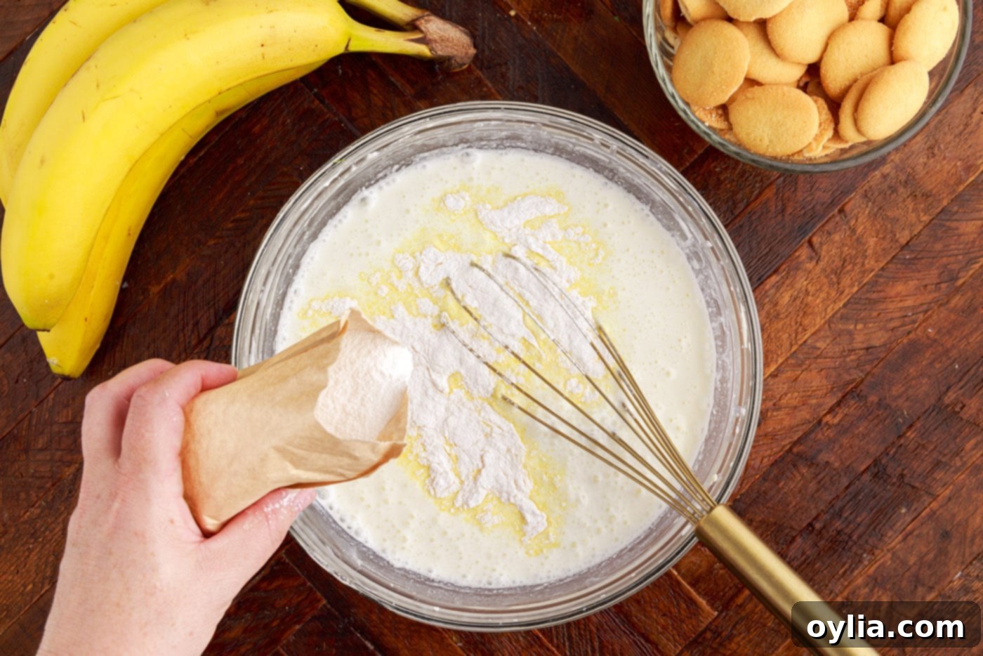 whisking instant vanilla pudding into cream cheese mixture