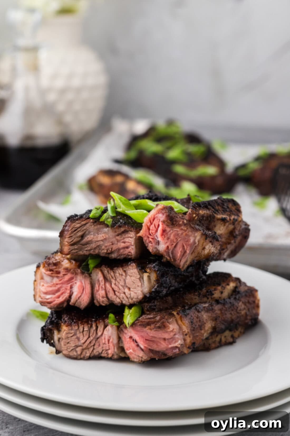 Stack of perfectly cut Korean Short Ribs on a plate, ready for marinating.