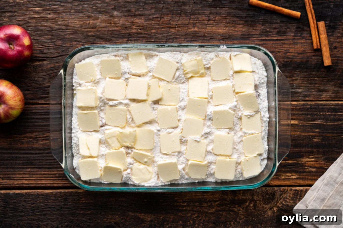 pats of butter on top of caramel apple dump cake