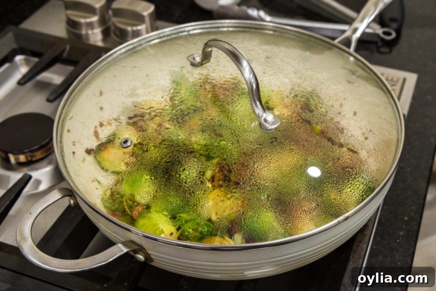 cooking brussels sprouts with bacon, shallots, and candied pecans