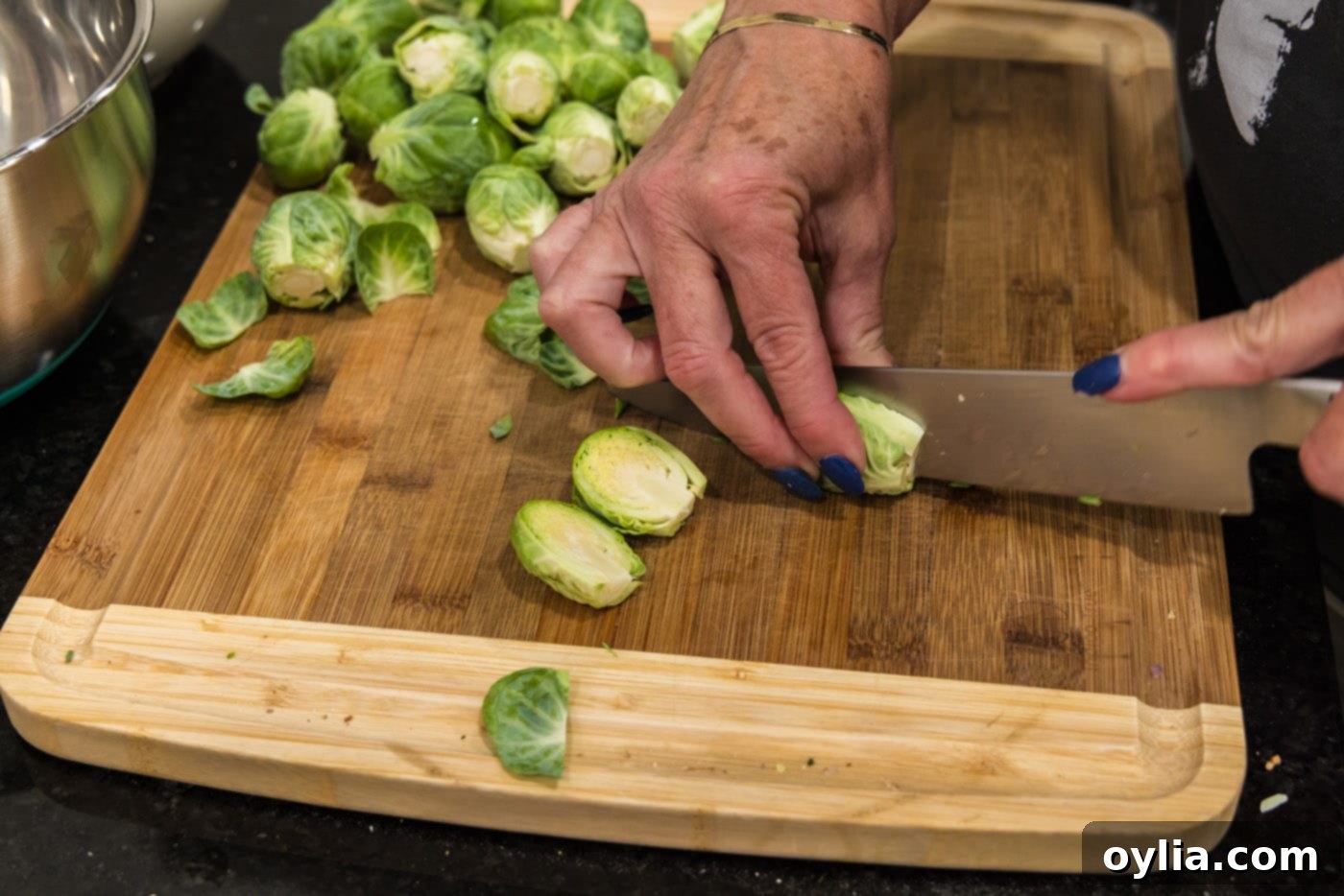 slicing brussels sprouts in half lengthwise
