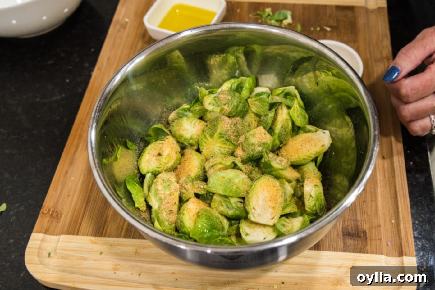 brussels sprouts in a bowl with seasoning