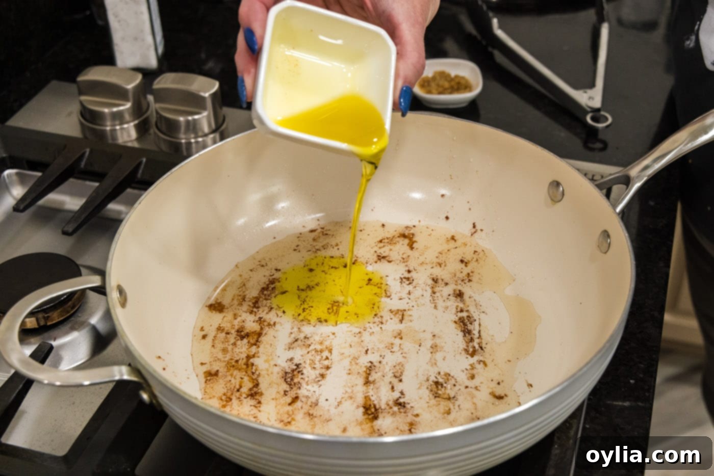 pouring oil into a skillet