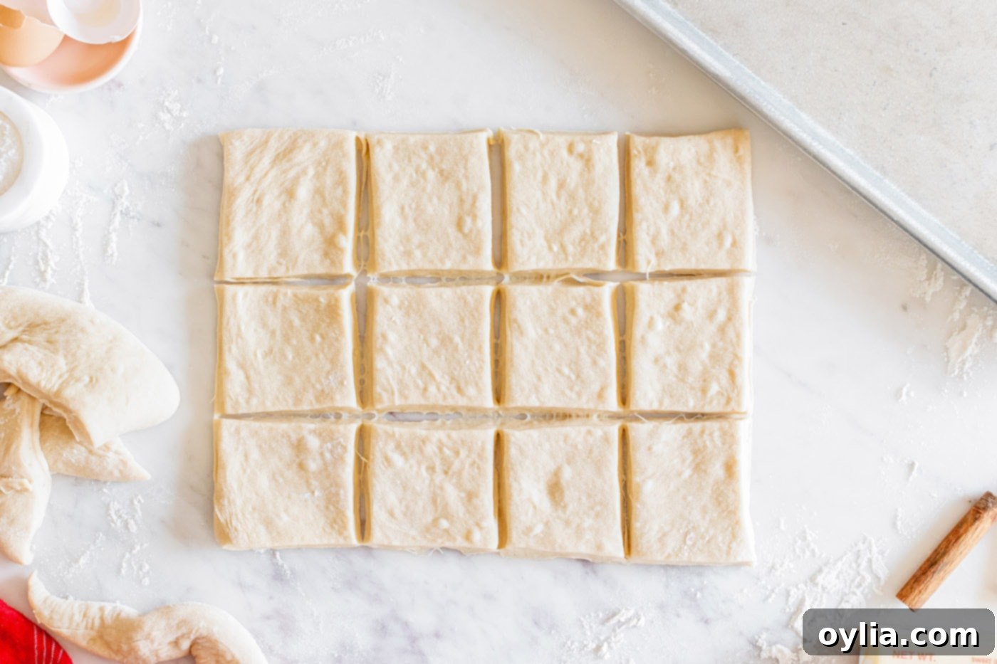 dough cut into squares for individual rolls