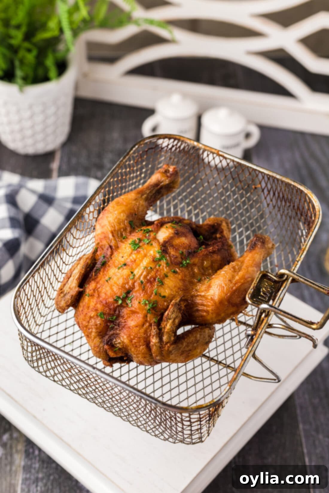 Southern Style Fried Cornish Hens 3 Deep Fried Cornish Hen in a deep fryer basket