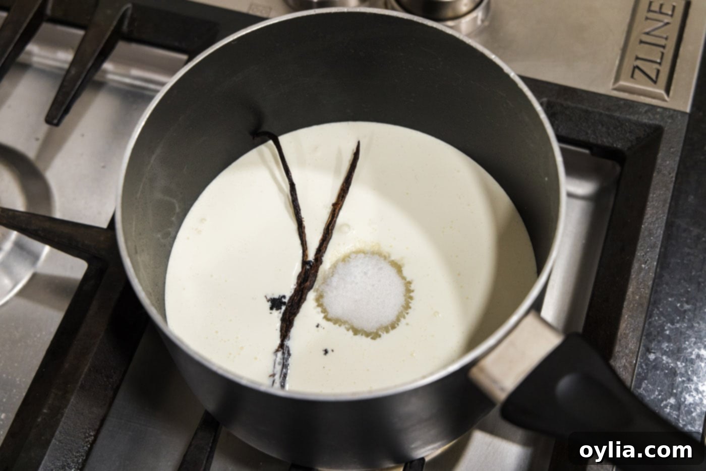vanilla bean added to saucepan with sugar