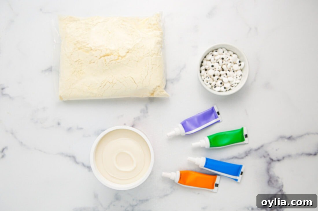 Ingredients for Monster Cupcakes: yellow cake mix, vanilla frosting, gel food coloring, and candy eyeballs displayed on a surface.