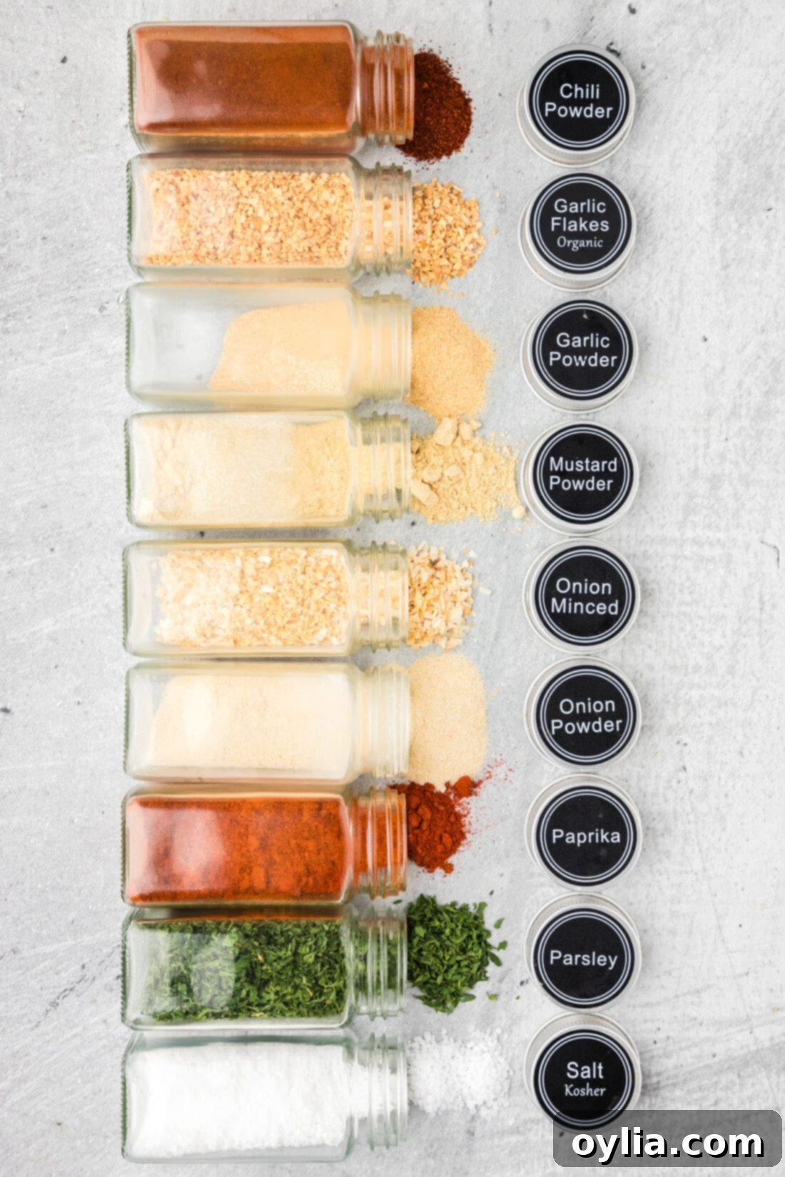 Spice jars of individual seasonings needed to create a custom All Purpose Seasoning blend
