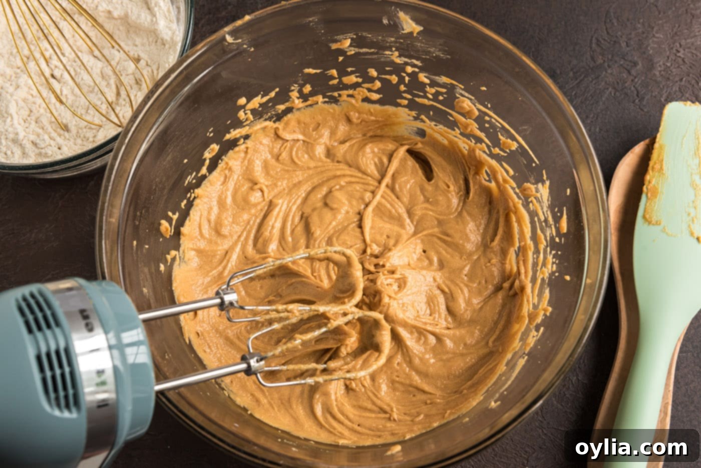 Bowl of perfectly mixed peanut butter cookie dough, ready for dry ingredients.