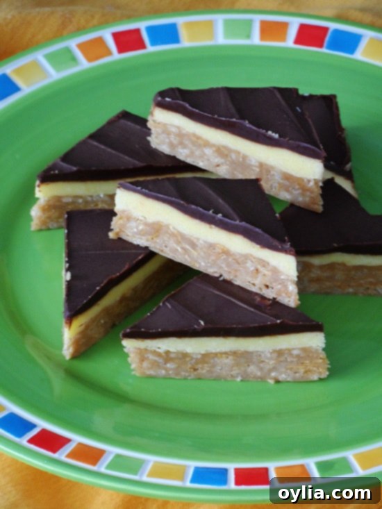 A second close up photo of no bake peanut butter pudding bars on a green plate, highlighting their delightful texture.