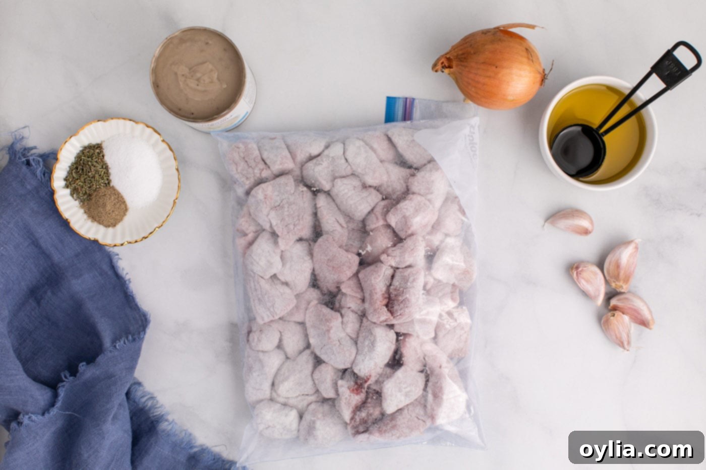 beef stew meat chunks in a bag with flour