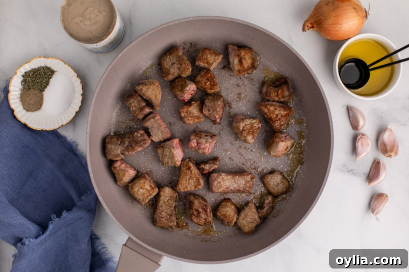 browned beef stew meat in a skillet