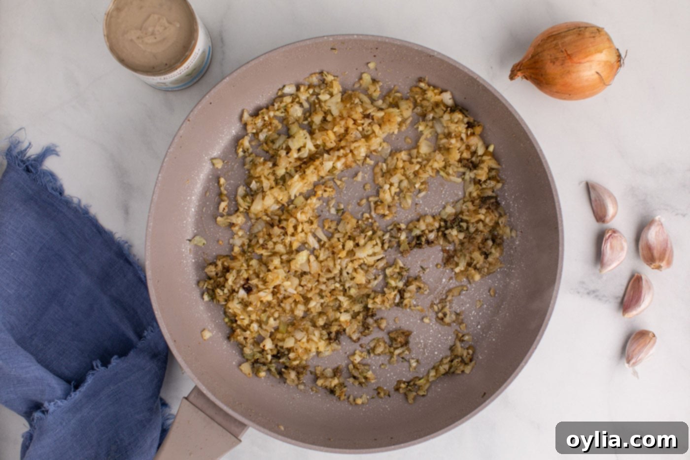 tender onions, seasonings, and garlic in a skillet