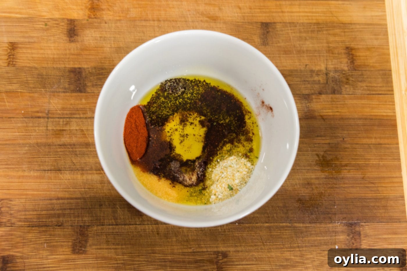 seasonings in a bowl with olive oil