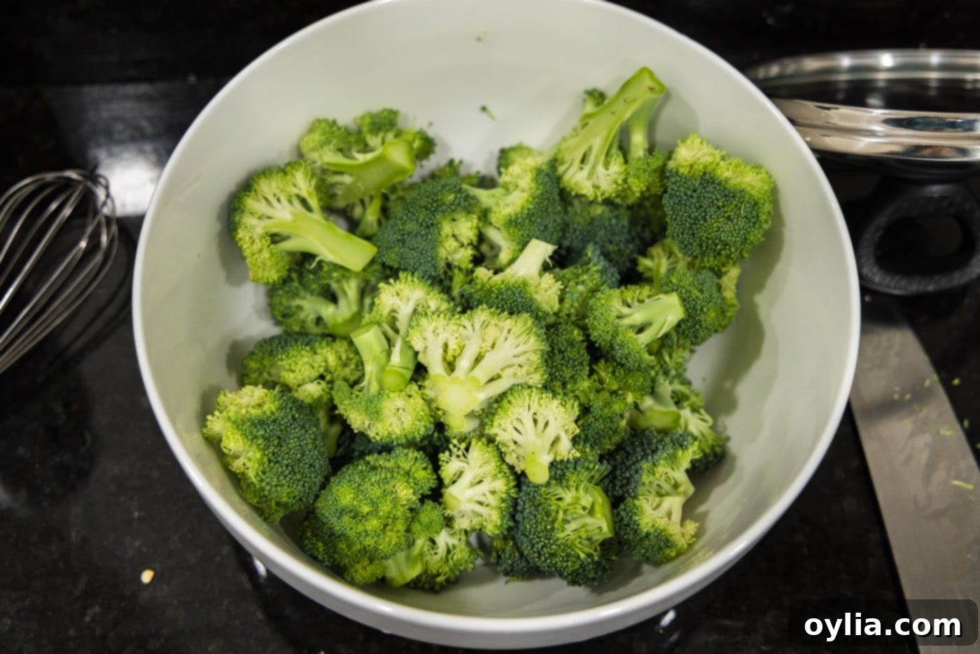 Fresh broccoli florets neatly chopped and prepared for the recipe.