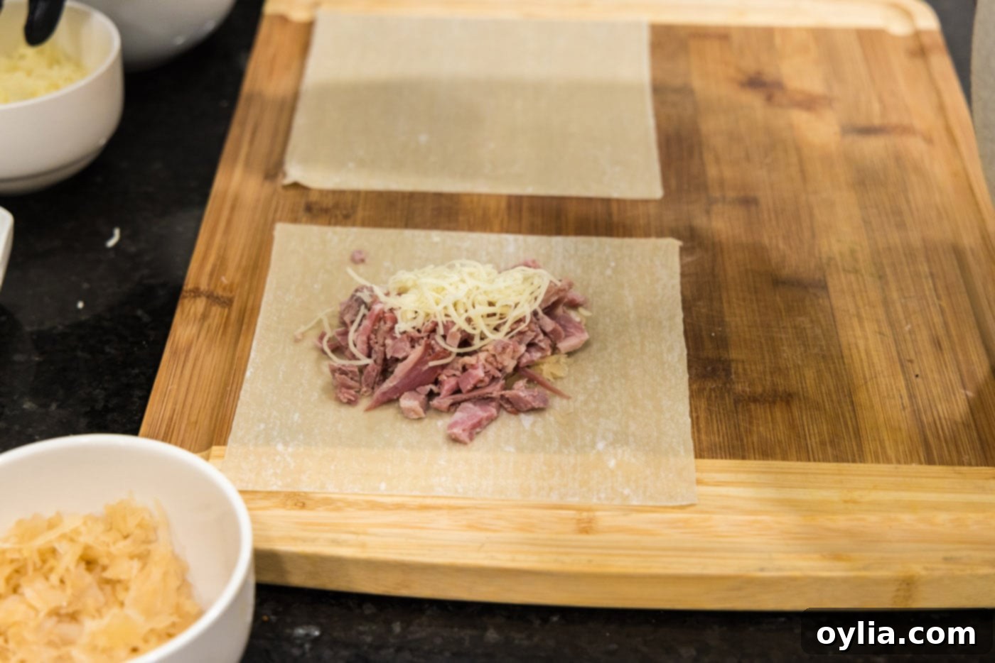 egg roll wrapper with corned beef and shredded swiss cheese