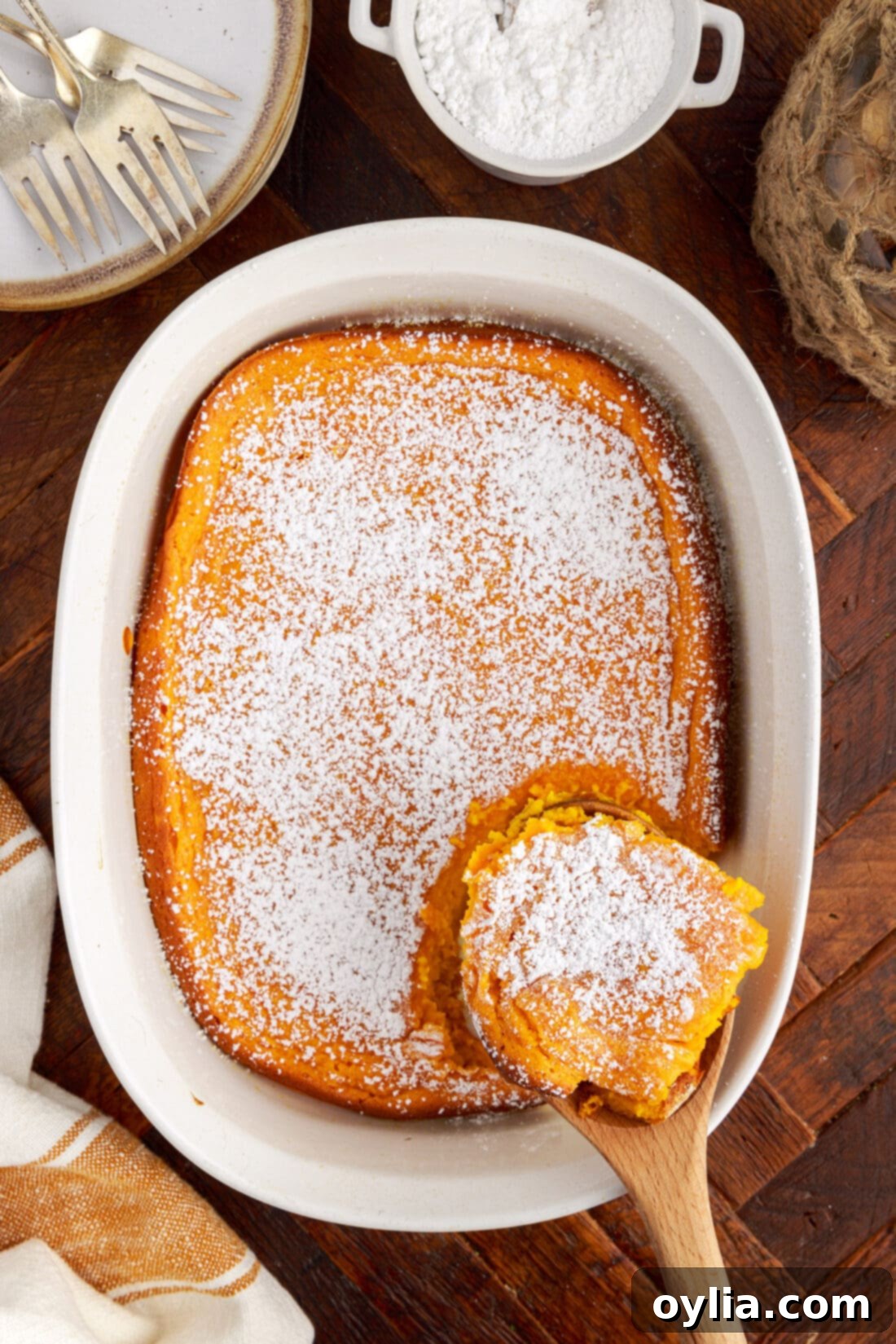 Serving of Carrot Souffle being removed from the dish by a spoon