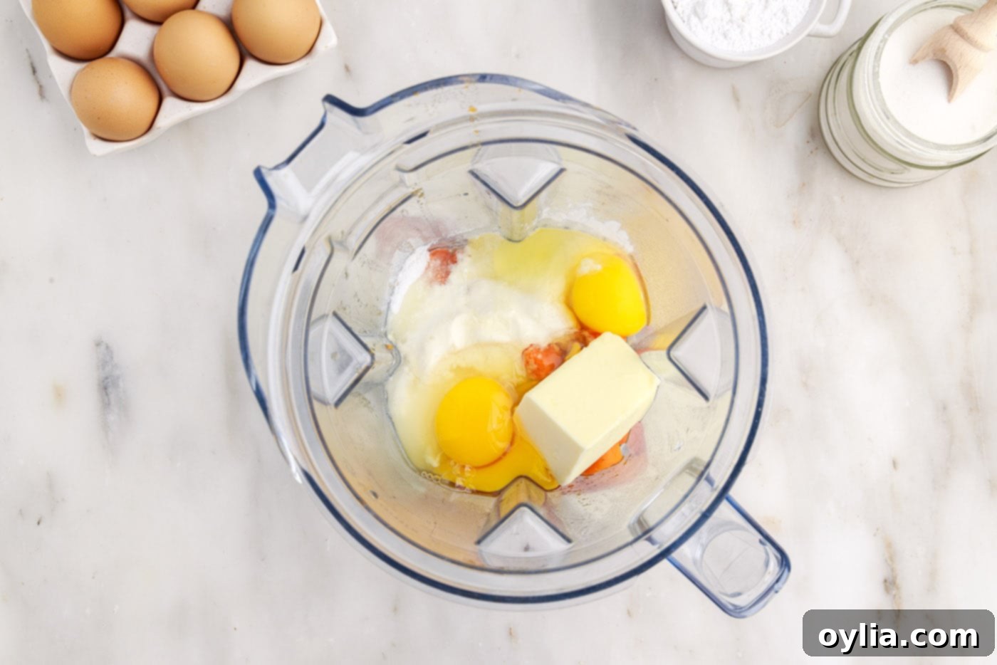 souffle ingredients with carrots in a blender bowl