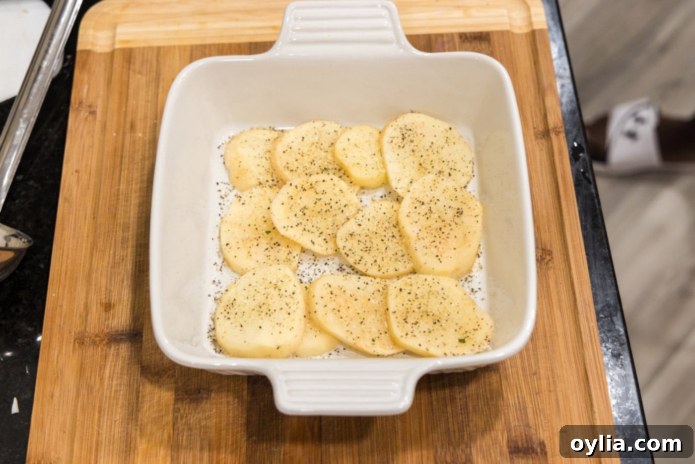 layer of sliced potatoes in a dish