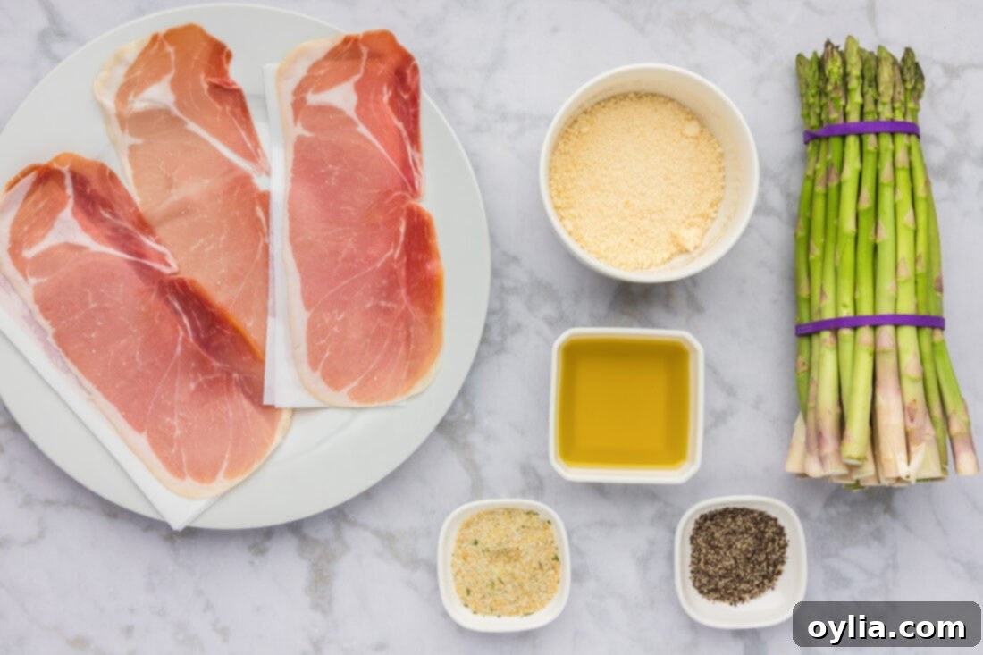 All ingredients for Prosciutto Wrapped Asparagus laid out on a table