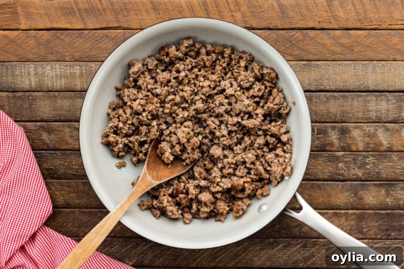 cooked and crumbled Italian sausage in a skillet, drained and ready for mixing