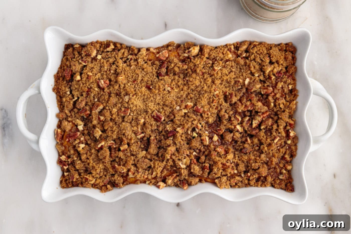 baked sweet potato souffle with golden pecan streusel crumble fresh out of the oven