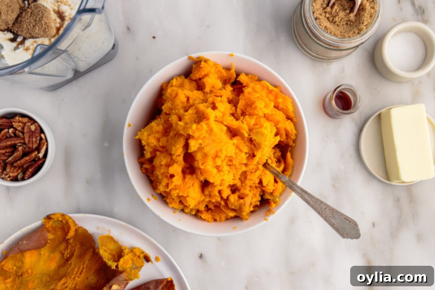 cooked sweet potatoes in a bowl, ready for mashing