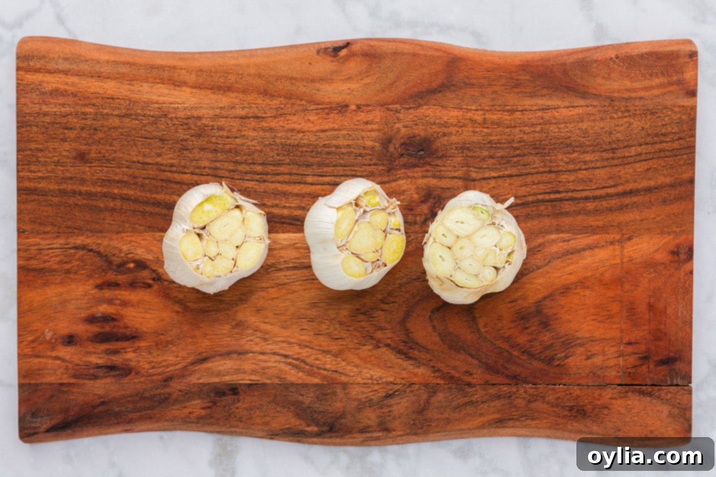 garlic bulbs with the tips sliced off