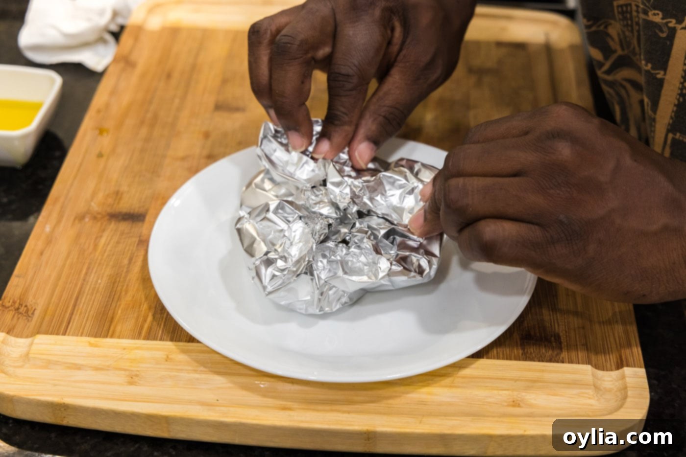 closing aluminum foil around garlic bulbs