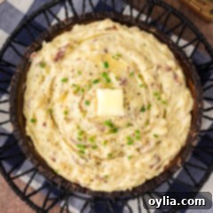 Close up photo of a bowl of Garlic Mashed Potatoes, showing texture and creaminess.