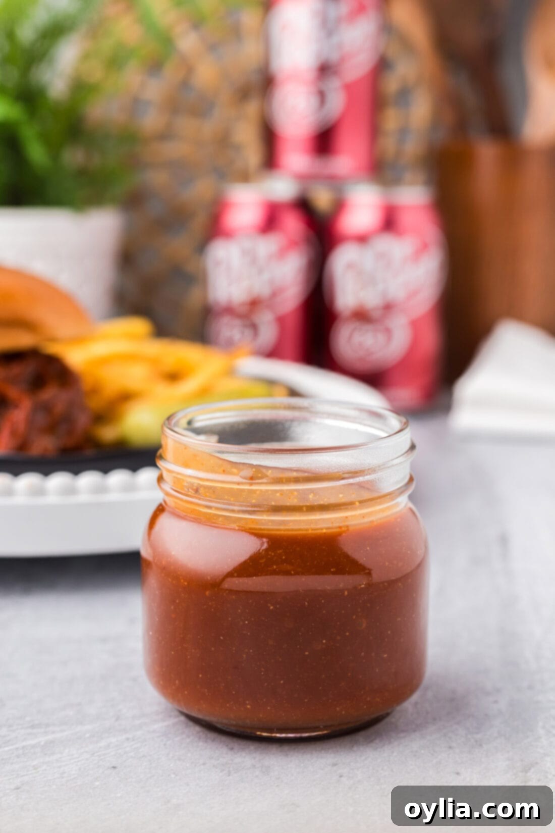 A jar of freshly made Dr Pepper Barbecue Sauce, ready for use.