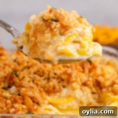 Close up photo of a heaping spoonful of Squash Casserole