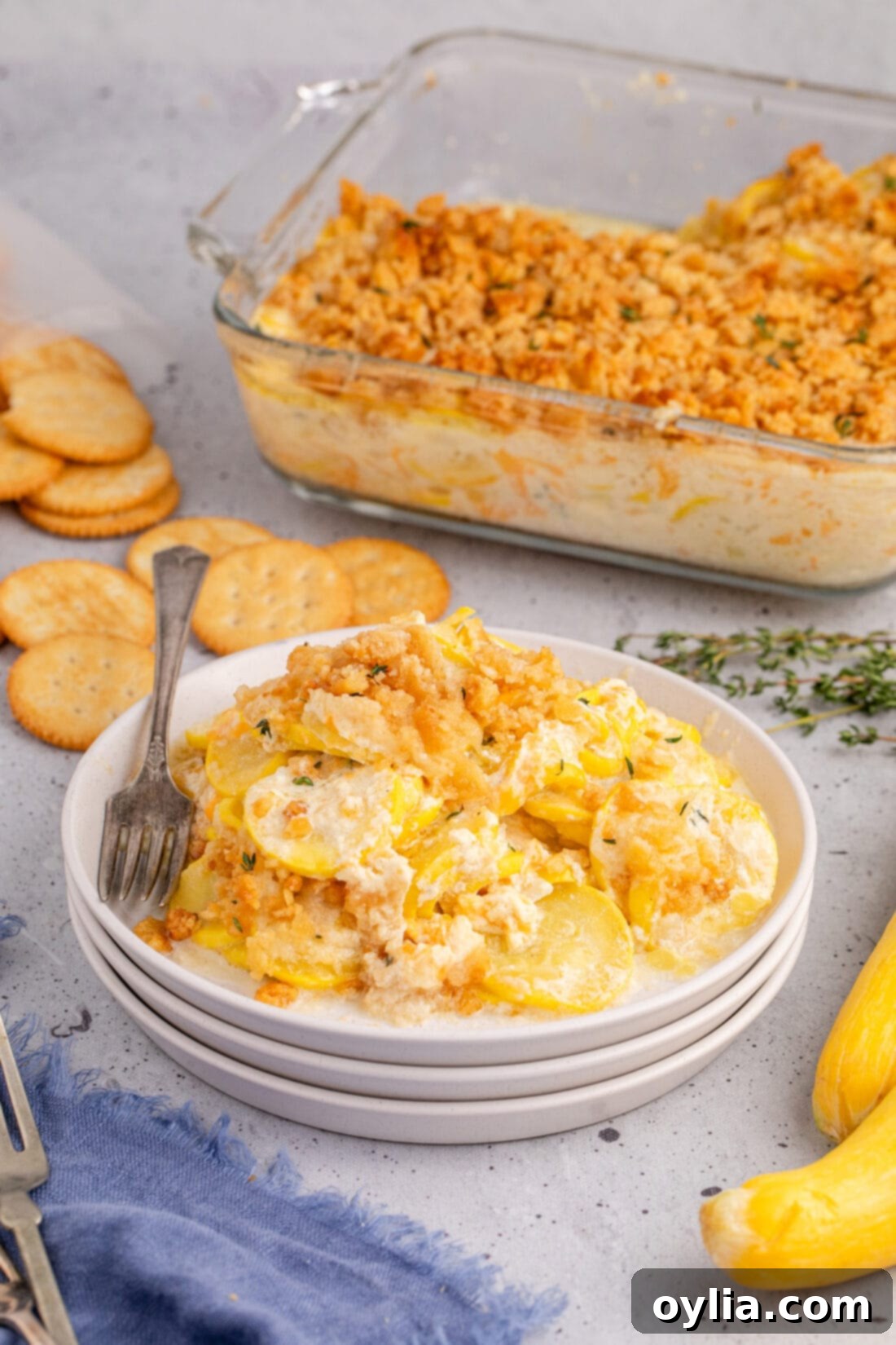 Squash Casserole on a plate with a fork, ready to be enjoyed
