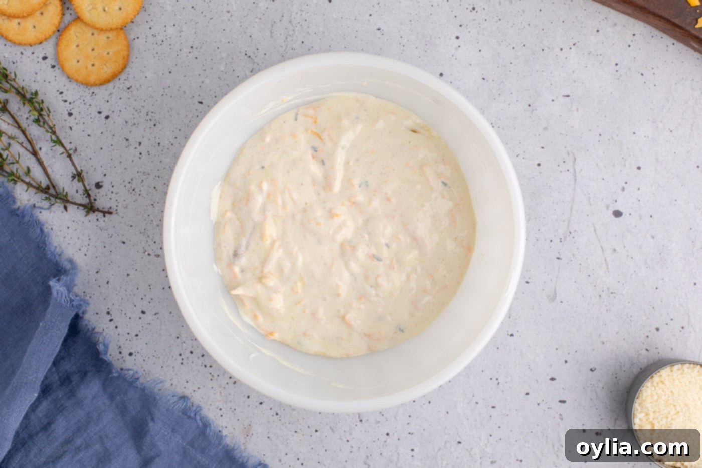 squash casserole filling in a bowl, showing the creamy mixture after combining