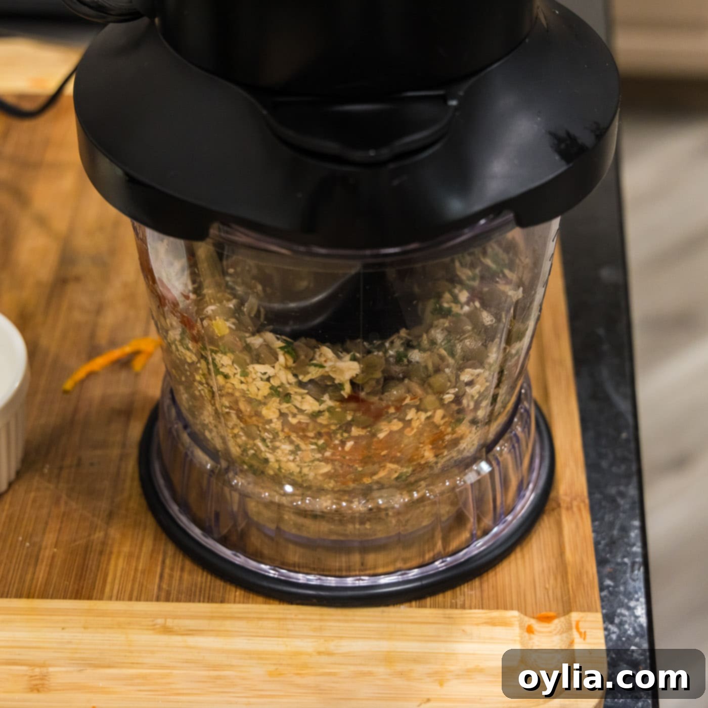 The lentil mixture is being blitzed in a food processor until fully combined and forming a dough-like consistency.