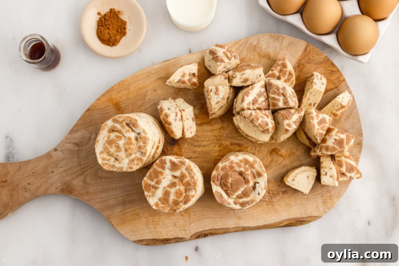 cinnamon rolls chopped on a cutting board