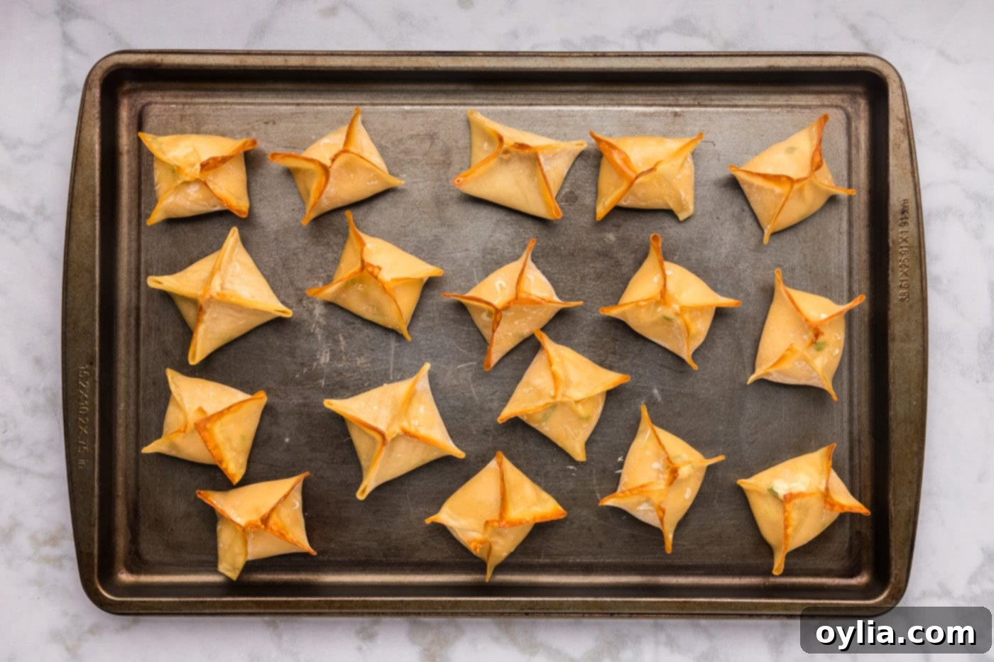 easy baked crab rangoon on a baking sheet
