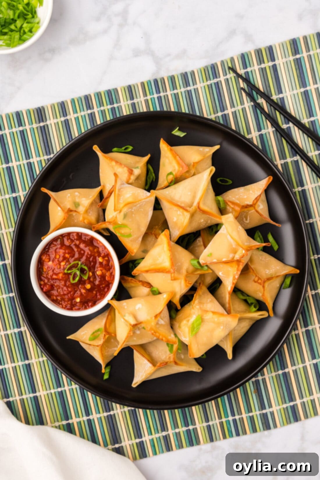 Overhead photo of a plate of Crab Rangoons