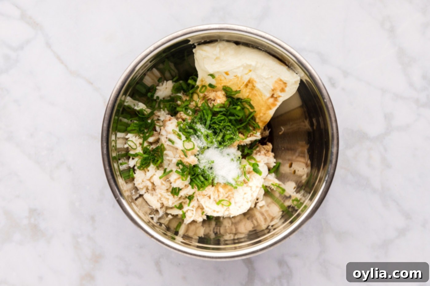 crab rangoon filling ingredients in a mixing bowl