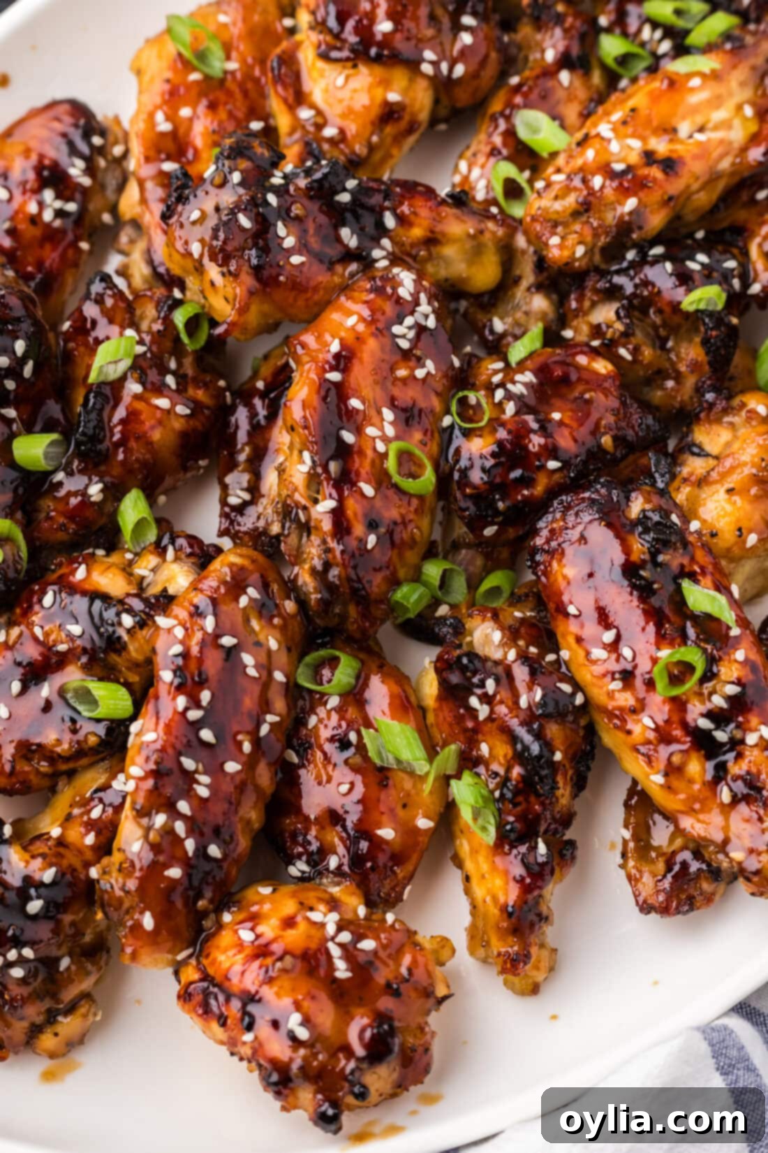 Sticky Honey Garlic Wings 12 Close up photo of a platter of Honey Garlic Chicken Wings