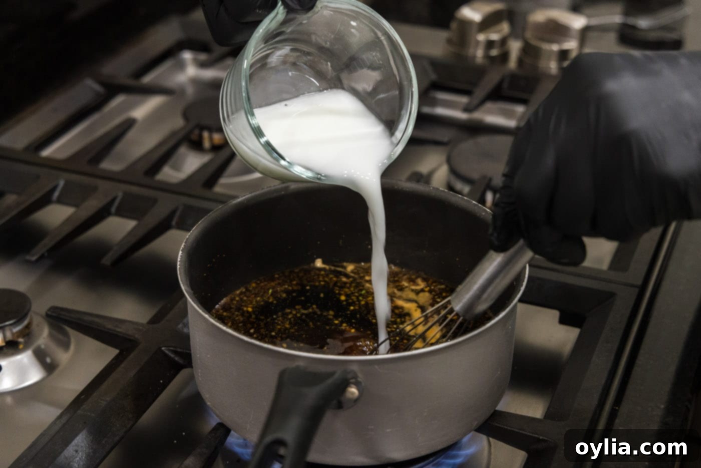 adding cornstarch slurry to thicken honey garlic sauce
