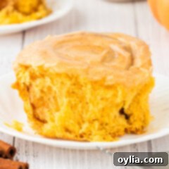 Close up photo of a Pumpkin Cinnamon Roll on a plate