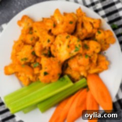 Buffalo Cauliflower on a plate with celery and carrots