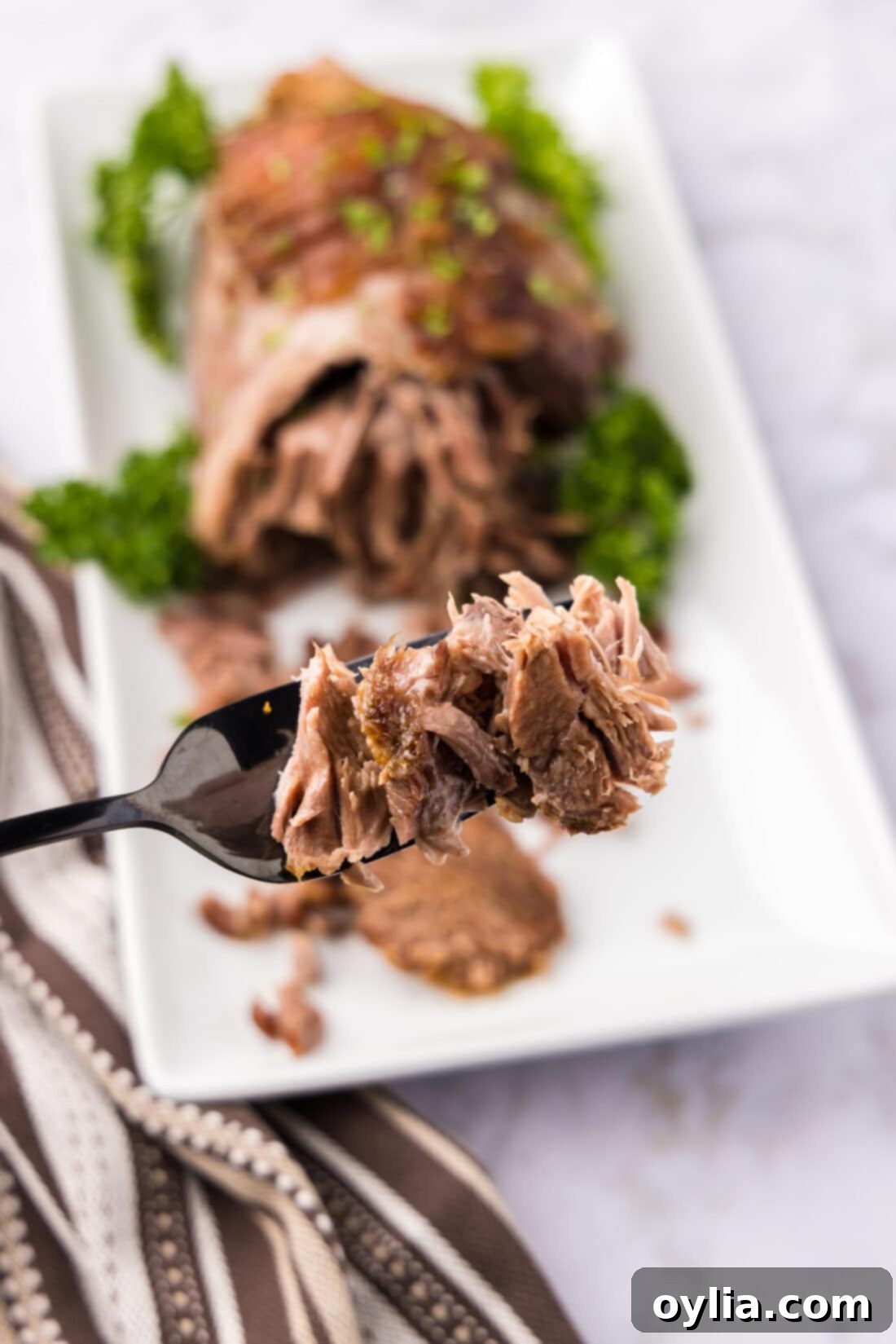 Slow-Roasted Lamb Masterpiece 3 Pieces of Leg of Lamb on a fork