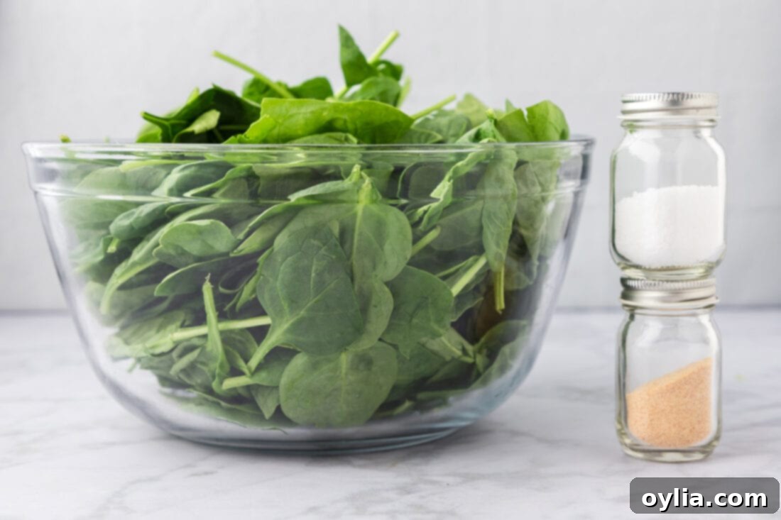 Nutrient-Rich Steamed Spinach 4 Ingredients for Steamed Spinach including fresh spinach, butter, and seasonings