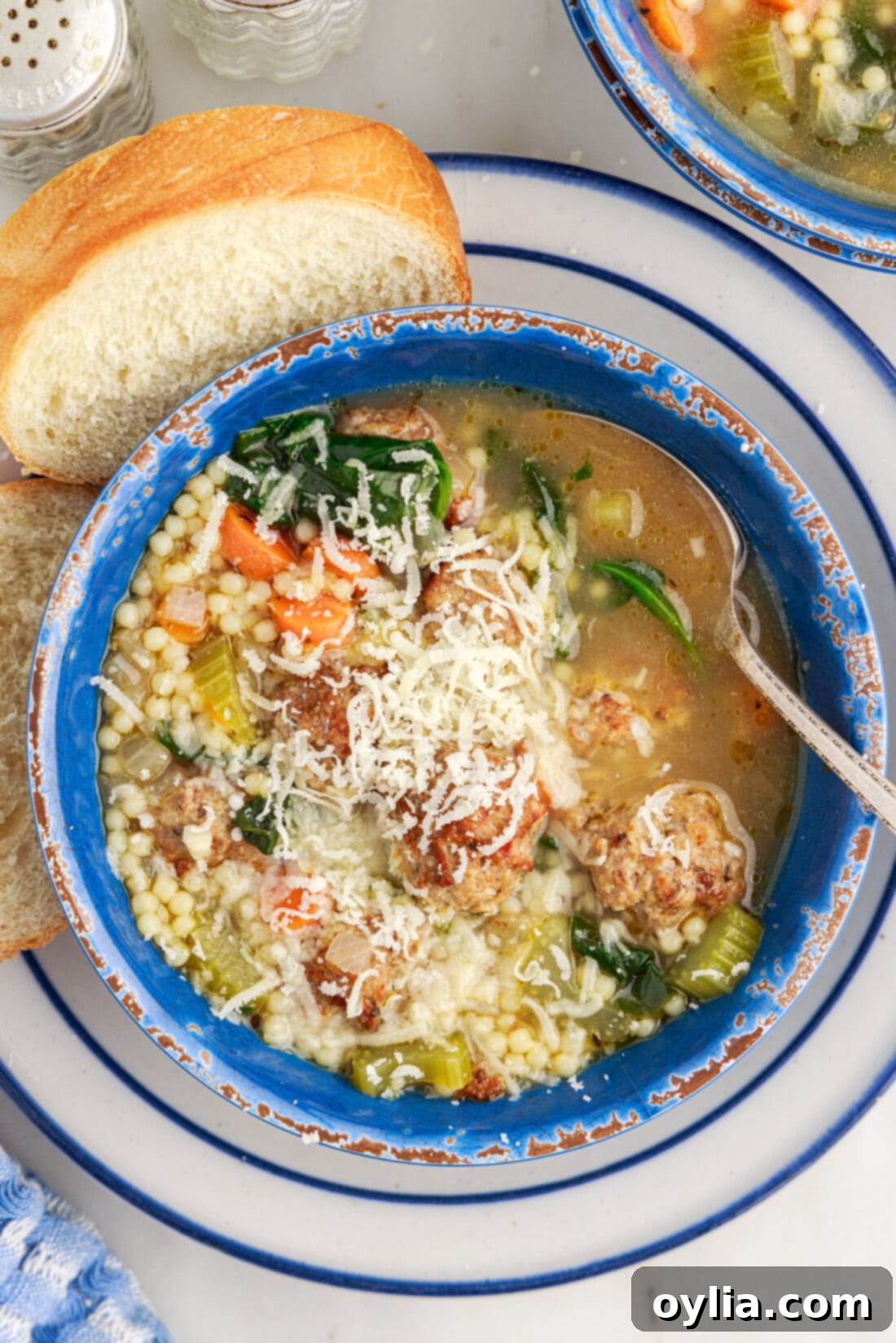 Bowl of Italian Wedding Soup topped with cheese