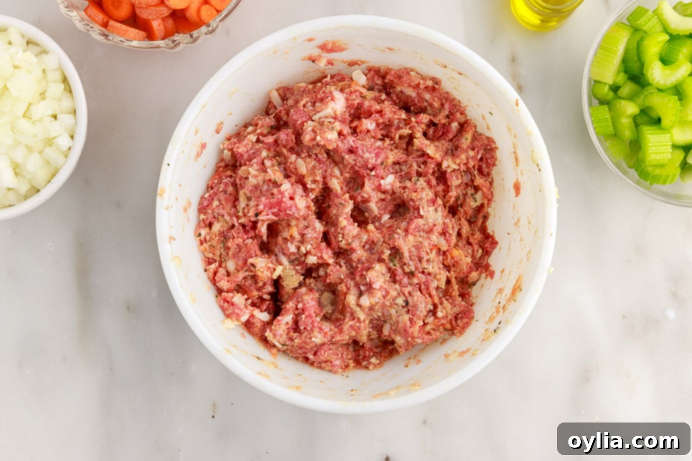 italian sausage and ground beef meatball ingredients in a bowl