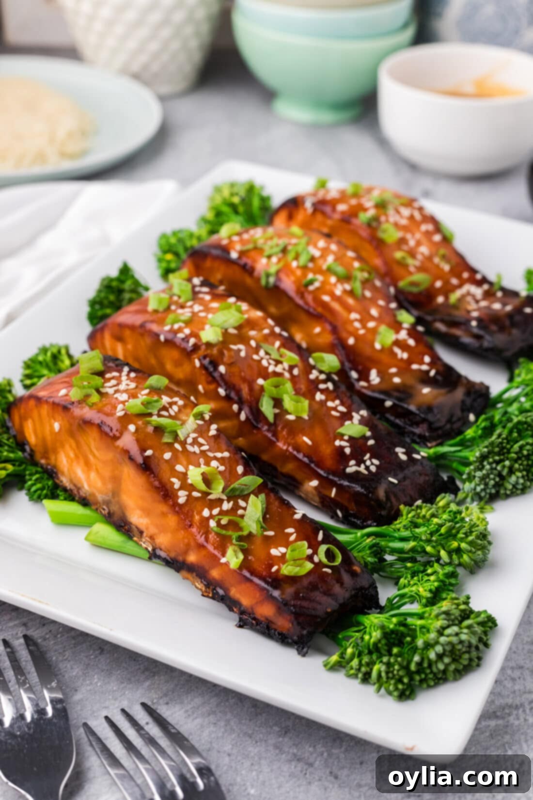 Side photo of Miso Salmon on a platter, garnished with green onions