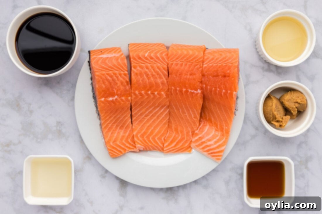Ingredients for Miso Salmon laid out on a white surface